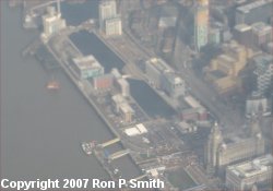 Liverpool waterfront from the air showing at the Pier Head (in the bottom right-hand corner), the Liver Building with it's twin towers and the Cunard Building [Photo: Ron P Smith]