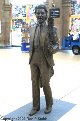 Statue of Ken Dodd in Lime Street Rail Station